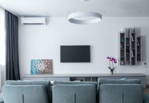 Living room with ductless AC unit.