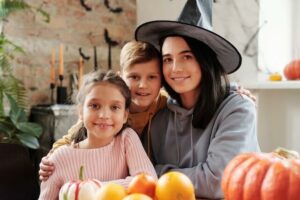 smiling family prepares for halloween