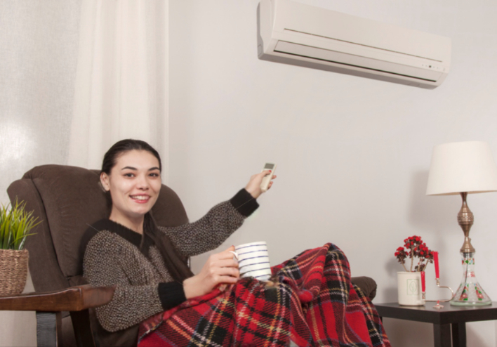 woman uses ductless heating