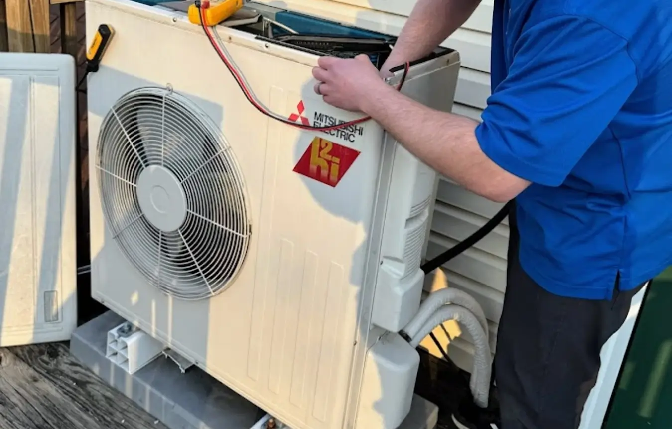 air-conditioning-installation HVAC tech working on air conditioning unit